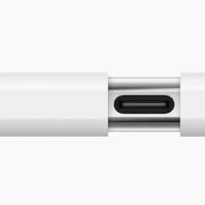 Close-up of a Lightning to headphone jack adapter connected to an iPhone showcasing wired audio compatibility.