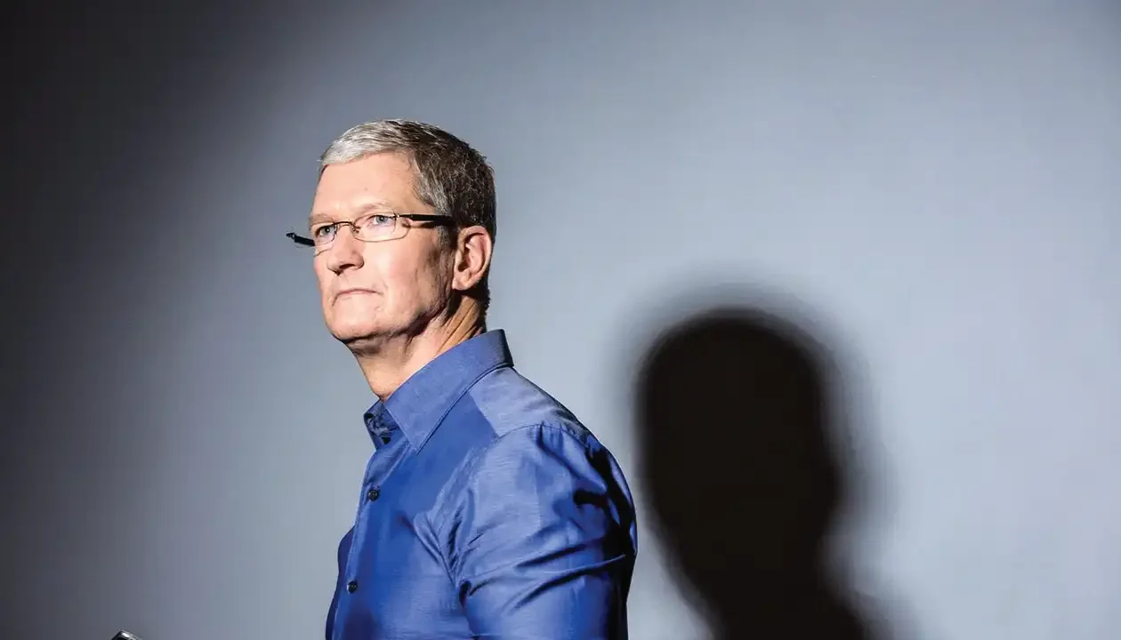 Apple iPhone and MacBook inventory stockpiled in a warehouse, highlighting the tariff-driven import surge and looming price hikes for 2025.