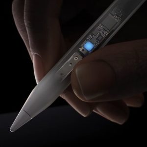 Close-up of a hand holding an Apple Pencil Pro with transparent casing, revealing intricate internal electronics. The stylus is poised over a dark, featureless surface, emphasizing precision and modern technology—perfect for the latest iPads and their advanced features.