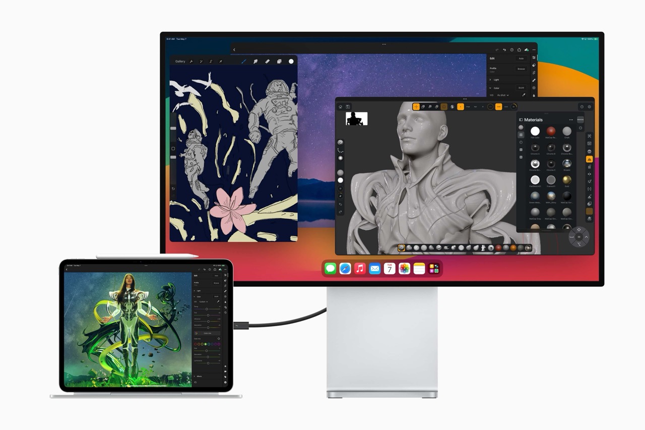 A computer monitor displaying a digital design workspace with a stylized astronaut, a flower, and a 3D model. The monitor is connected to a tablet showing a vibrant artwork of a futuristic character in green attire. Both devices are showcasing creative content.