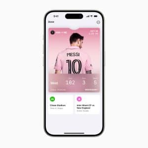 A smartphone screen displaying a sports event interface. The main image features a player with the name "MESSI" and the number "10" on a pink jersey. Information includes a match between Miami and New England on October 19, time 7:30 PM, with additional details below.