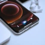 iPhone screen displaying the Siri chatbot prototype interface with a sleek, translucent design, showcasing Apple’s advanced AI rivaling ChatGPT, set for potential iOS 19 release.