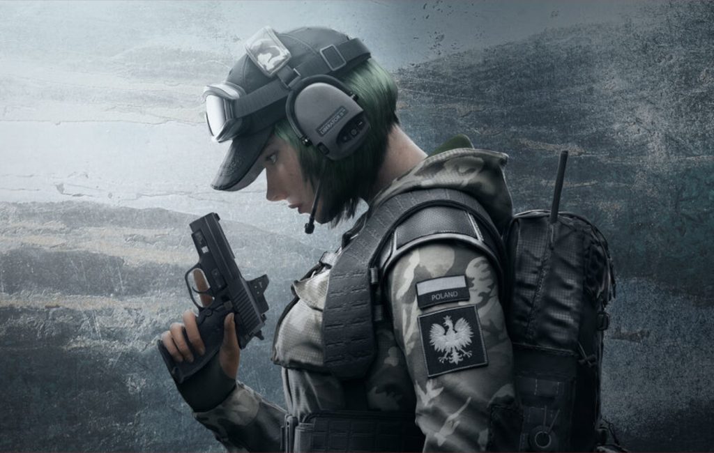 A soldier in camouflage gear and a tactical helmet, with slight green hair visible, holds a handgun in their right hand. The uniform features Polish insignia on the sleeve, reminiscent of a Rainbow Six Siege operator, against a textured, weathered background.