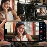 A woman sits with her chin resting on one hand, looking contemplative, in a diner booth. The scene, captured using the Blackmagic Camera App, is monitored on an iPad version, which mirrors the live view from the camera perfectly.