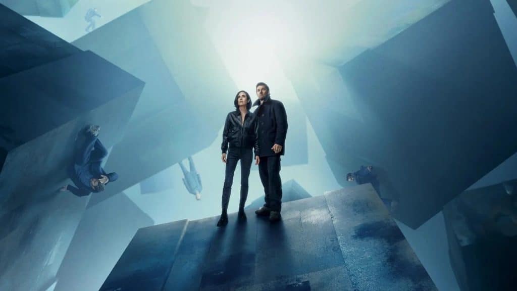 Dark Matter Series Season 2 | Apple TV+ | A woman and a man stand atop a geometrically abstract platform, surrounded by floating, angular shapes against a bright, surreal background. Other figures in the distance appear to be suspended in various positions, evoking a disorienting, dreamlike atmosphere reminiscent of Dark Matter Season 2.