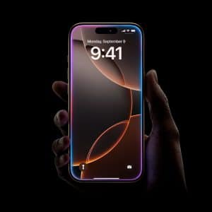 A hand holding a sleek iPhone with a dark, abstract wallpaper. The phone displays the time as 9:41 on Monday, September 9. The screen has a small notch at the top. The Apple logo is visible in the bottom right corner. The background is pitch black.