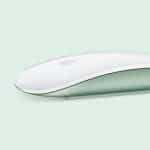 A sleek, flat white computer mouse with an Apple logo, shown in profile on a soft mint green background. The bottom part of the mouse is light green, creating a modern and minimalist look.