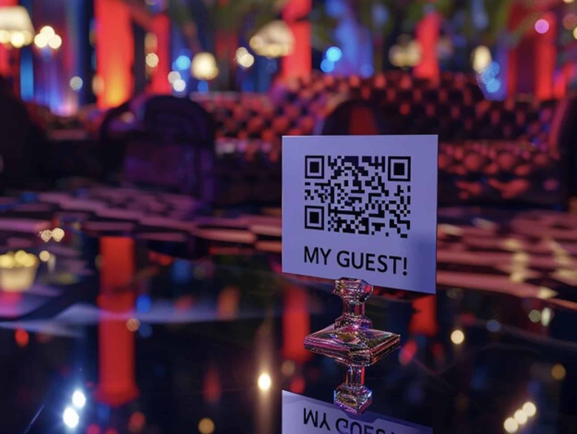 A QR code on a sign reading "MY GUEST!" graces a reflective surface. The vibrant background, with colorful lights and abstract patterns, enhances user engagement by inviting interaction in an elegant venue or event space.