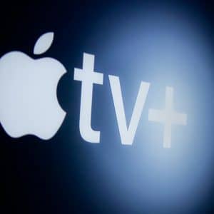 The Apple TV+ logo stands out against a dark background, featuring the iconic Apple symbol followed by "tv" and a plus sign. Illuminated with a soft glow, this emblem represents the best experience in entertainment apps.