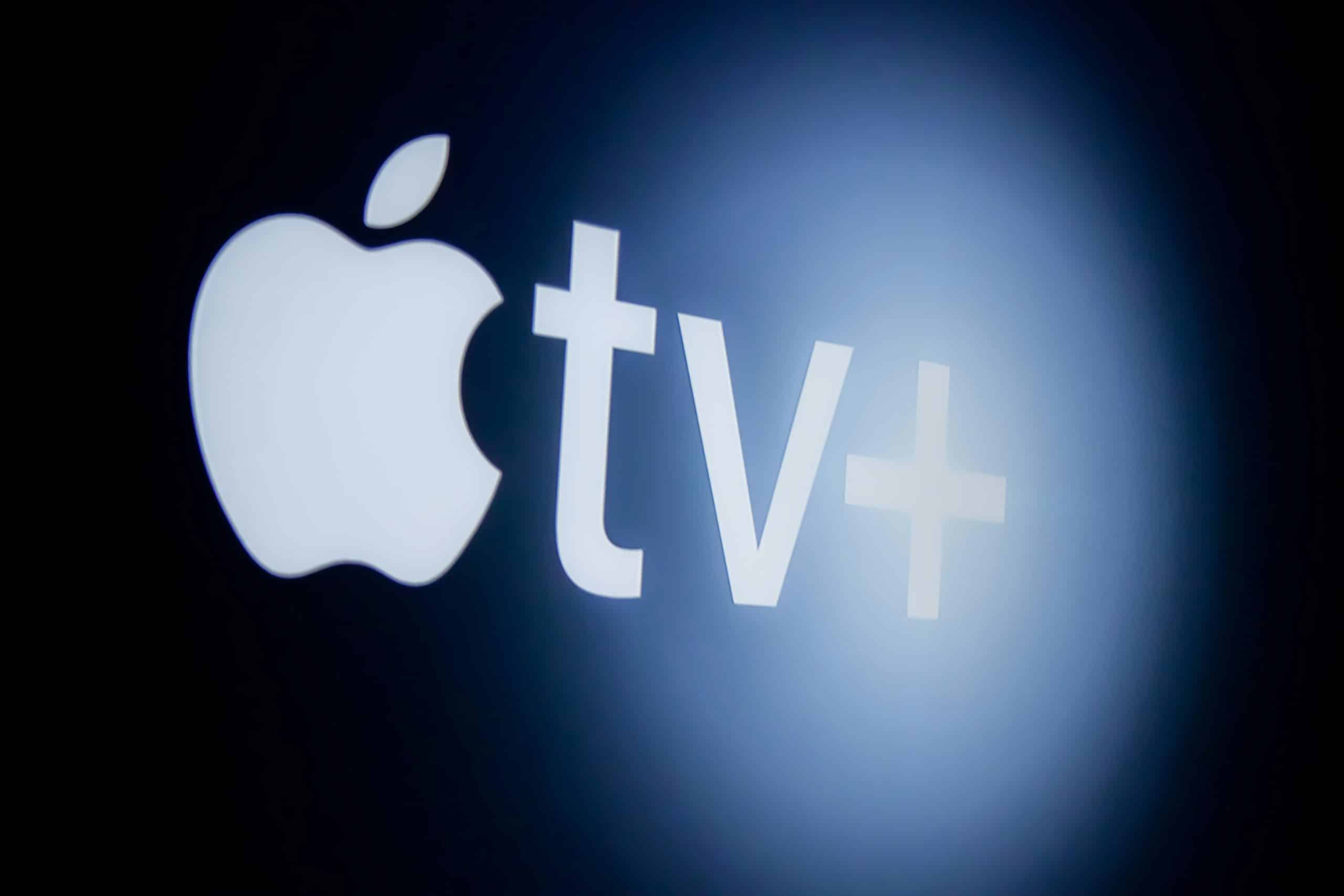 The Apple TV+ logo stands out against a dark background, featuring the iconic Apple symbol followed by "tv" and a plus sign. Illuminated with a soft glow, this emblem represents the best experience in entertainment apps.