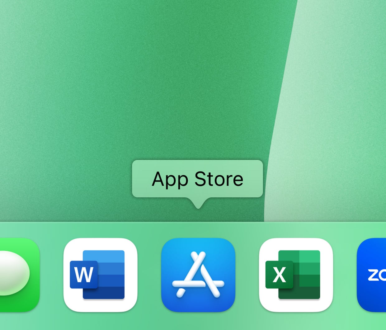 A computer dock with four app icons: Word, App Store, Excel, and Zoom. The App Store icon is highlighted with a label above it. The background is a gradient of light green shades.