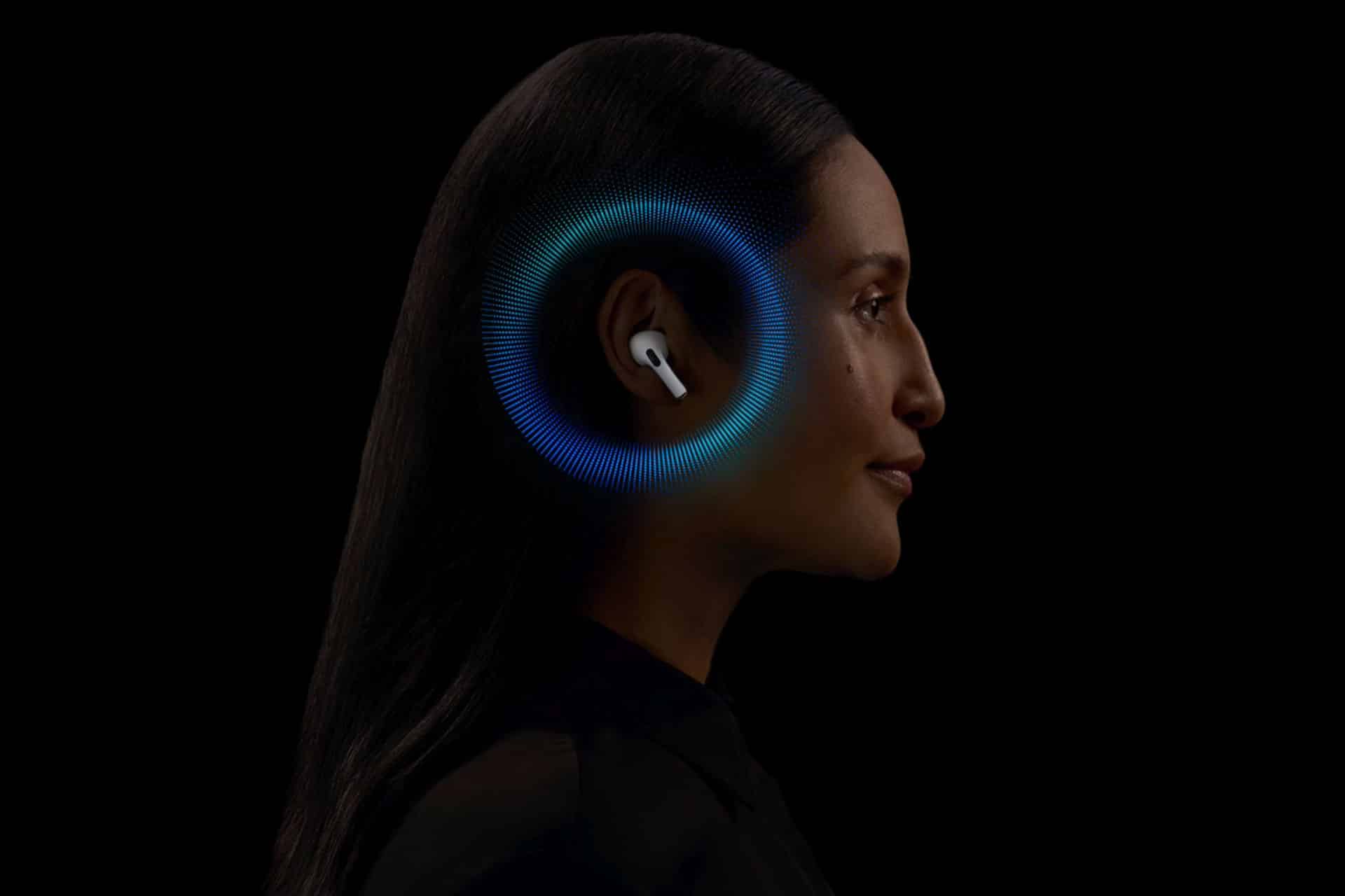 A woman wearing wireless earbuds is shown in profile against a black background. A glowing blue and green circular graphic encircles her ear, suggesting audio features or sound waves, enhanced by visionOS 3.0 technology for an immersive sound experience.