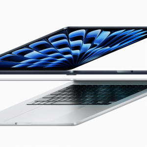 Two sleek MacBook Air laptops with one in a closed position above the other in an open position, revealing a vibrant blue screen. They feature slim designs and black keyboards, with the iconic Apple logo displayed at the bottom right corner.