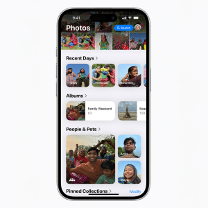 A smartphone screen showcases a photo gallery app on iOS 18, featuring sections like "Recent Days," "Albums," and "People & Pets." The display is filled with thumbnail images of people and pets in various activities, while an Apple logo graces the bottom right corner.