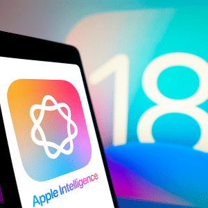 A smartphone showcasing the "Apple Intelligence" logo and name against a vibrant gradient backdrop sits before a screen displaying the number 18, hinting at the exciting features of the upcoming iOS 18.3 release.