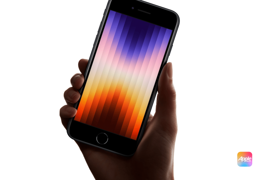 A hand holds an iPhone SE 4th Gen, showcasing a gradient wallpaper with vertical stripes in shades of purple, pink, and orange. The phone features a black front with a circular home button, and the iconic Apple logo is visible in the bottom right corner.