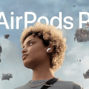 A person with short curly hair, wearing the new AirPods Pro 3, looks to the side. Against a cloudy sky with floating cars and debris around them, the Apple logo and "AirPods Pro" text highlight this scene.