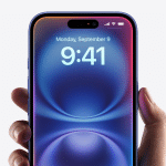 A hand holds a smartphone showing the time 9:41 on a vibrantly colored blue and purple screen. The date, Monday, September 9, is displayed at the top. The Apple logo graces the bottom right corner of this sleek device with its minimal bezel design, subtly suggesting you disable Apple Intelligence for a cleaner look.