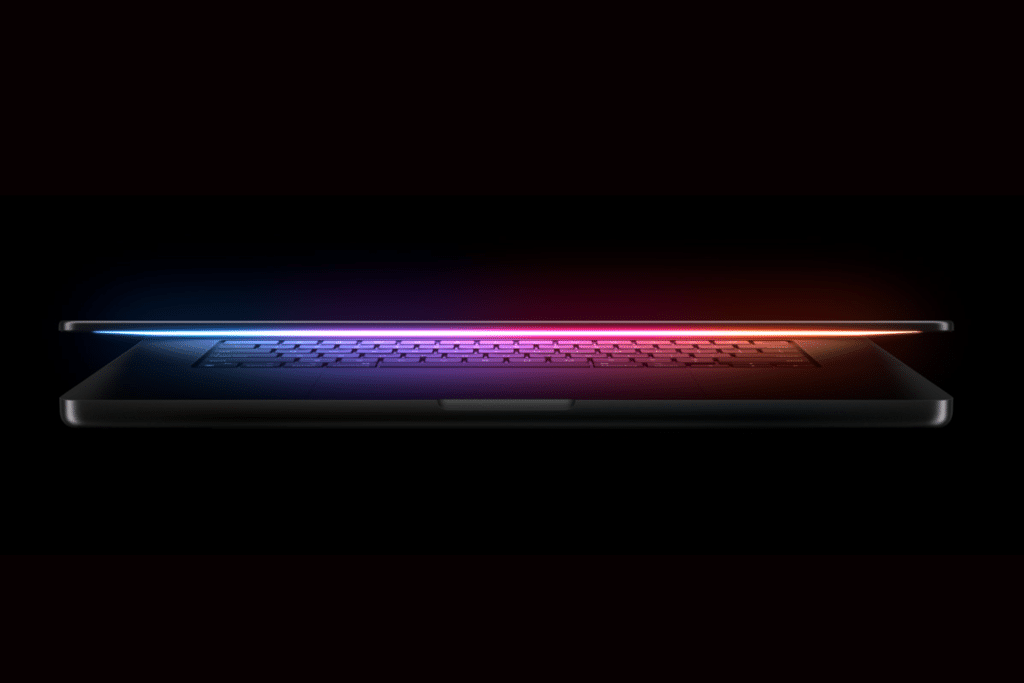A sleek M5 MacBook Pro in Space Black, open on a modern desk with a vibrant display showing creative software, highlighting its powerful M5 chip and professional-grade design for 2025.