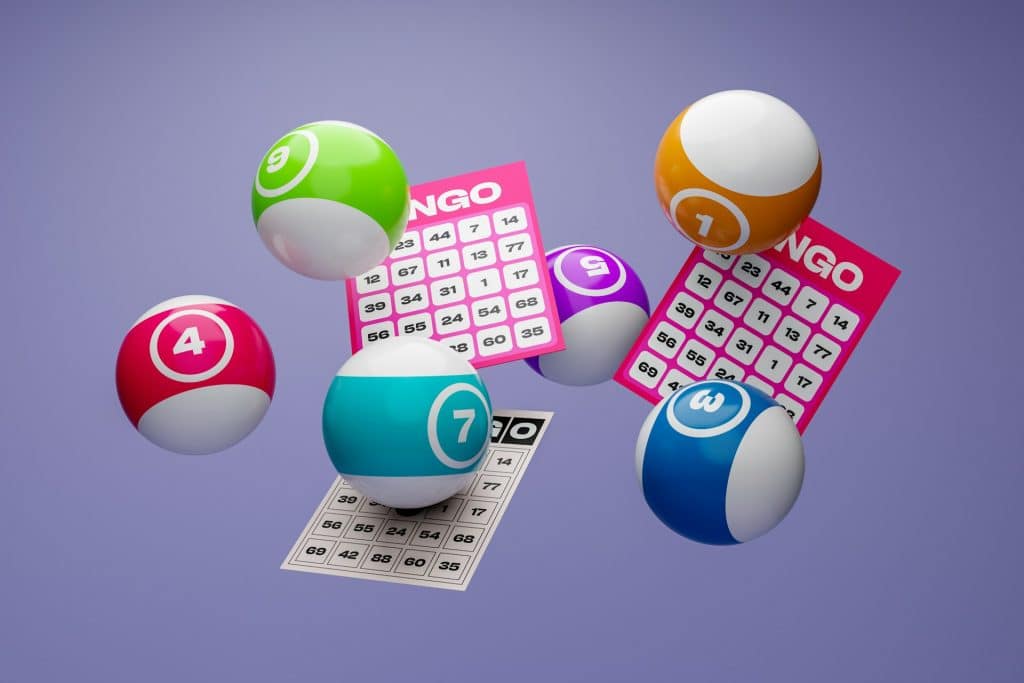 Colorful bingo balls numbered 3, 4, 7, 9, and 11 float alongside bingo cards in mid-air against a purple background. As we look to the future in 2025, trying your luck with these vibrant games brings a dynamic, playful scene to life.