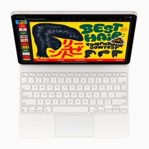 A laptop displaying an open browser window featuring a colorful illustration titled "Best Hair Pompadour Contest." The design includes a large pompadour hairstyle and bold, stylized text against a bright yellow background. The keyboard is visible below.