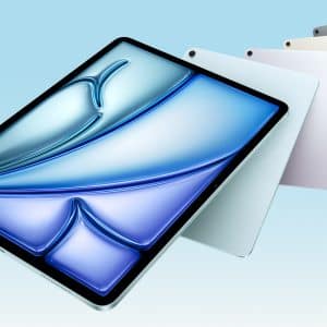 A tablet with a blue, abstract wave design on the screen is displayed at an angle. Behind it, four tablets in different colors are fanned out against a light blue background.