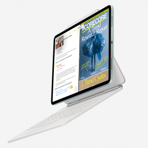 A tablet with a sleek keyboard case displays an open document and a magazine cover featuring a vibrant blue flower. It elegantly floats against a pristine white background, showcasing the seamless integration of technology and style.