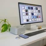 Front view of the new Mac Studio powered by the Apple M3 Ultra chip, showcasing its compact design and high-performance capabilities on a minimalist desk setup.