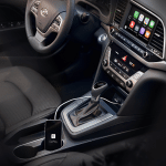 Apple CarPlay EV support enhances electric vehicle navigation with battery tracking and charger suggestions, currently limited to Ford and Porsche models.