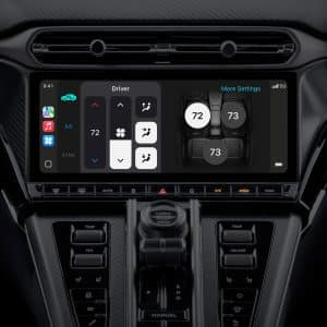 Close-up of a car's digital dashboard touchscreen displaying climate control settings alongside Apple Maps integration. The sleek, black interior highlights advanced features like temperature adjustment, fan speed, air direction, and seat A/C options.