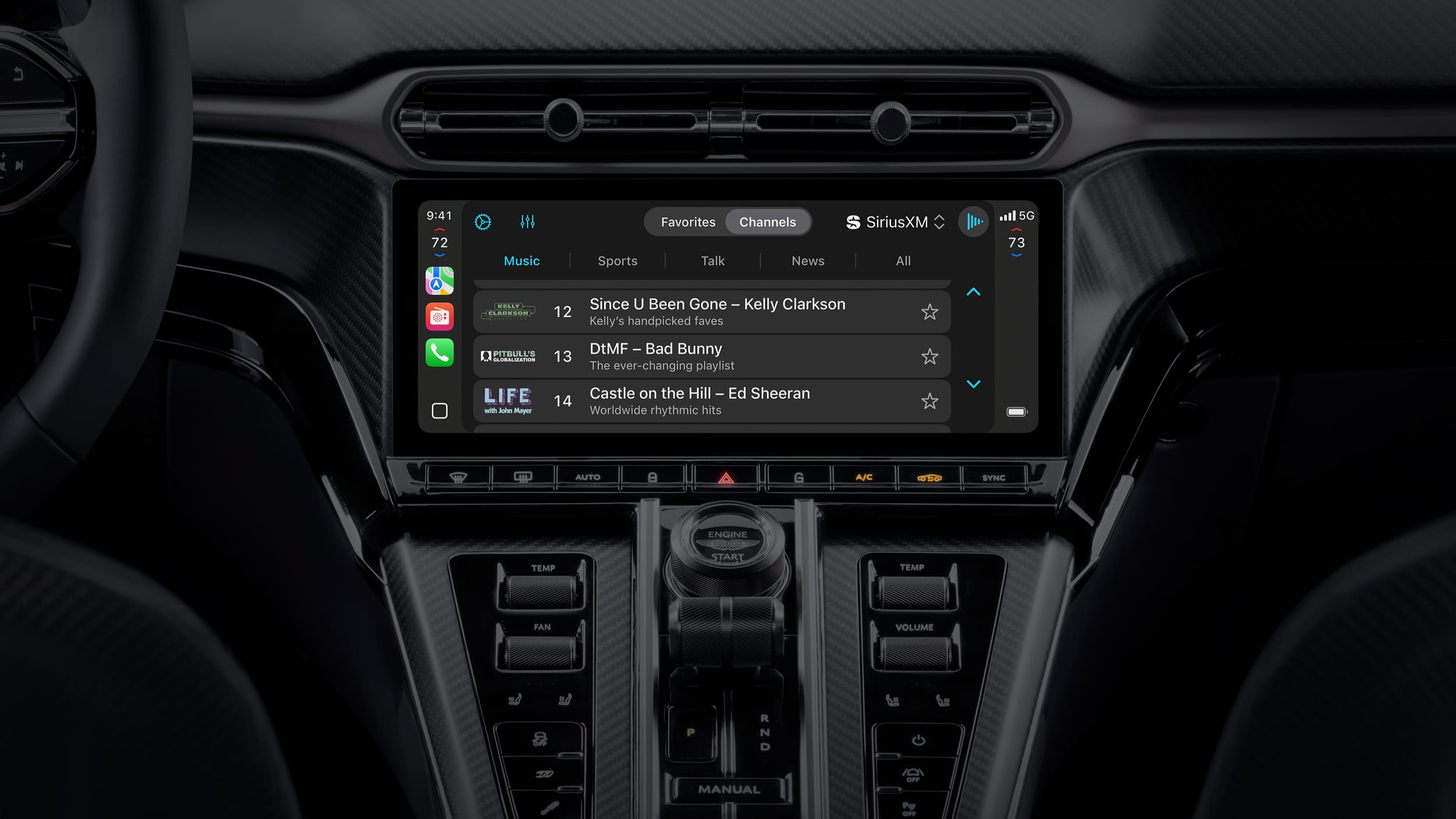 A car dashboard displays a touchscreen with SiriusXM radio and Apple Maps MICHELIN Ratings, showing song titles by Kelly Clarkson, Bad Bunny, and Ed Sheeran. The surrounding dashboard features black controls and a gear shifter.