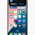 An iPhone screen displays a notification at the top, prompting to share Apple accessibility features, with "Decline" and "Accept" options. Various app icons are visible on the home screen, reflecting Apple 2025 design trends.