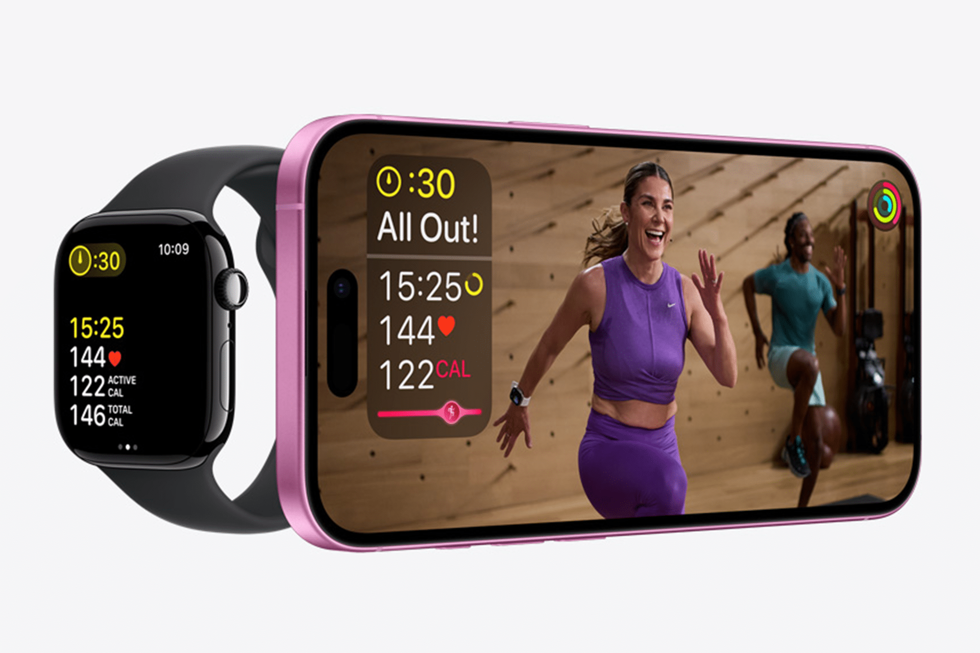 A smartwatch displaying workout stats sits beside a smartphone showing two women exercising indoors at The Studio, with fitness metrics and heart rate information overlaid on the screen.