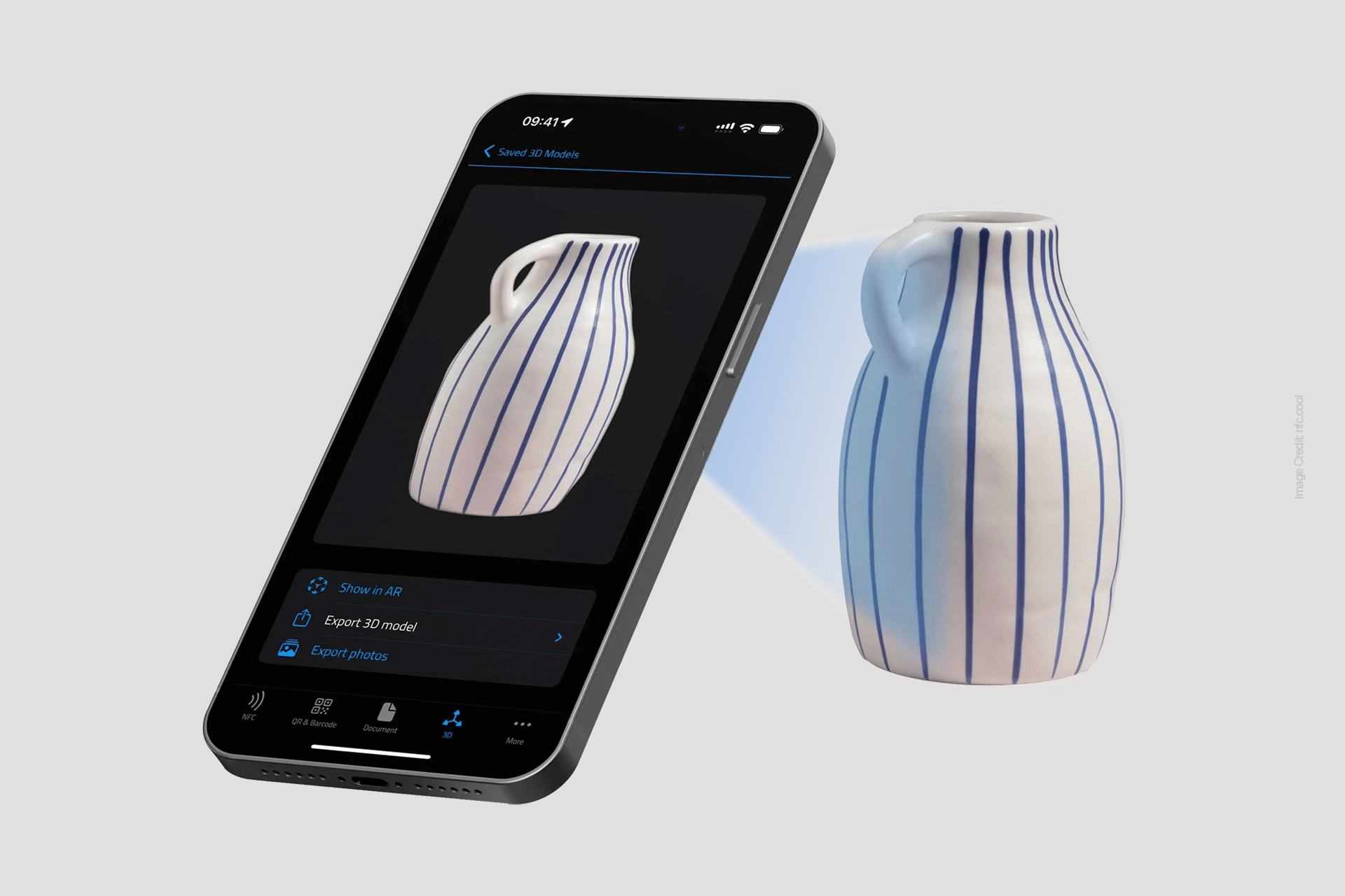 A smartphone uses Apple Intelligence Tools to scan a white ceramic pitcher with blue vertical stripes, displaying a 3D model of the pitcher on its screen against a plain light background.