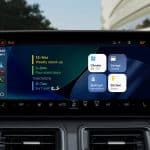 Apple’s next-generation CarPlay interface displayed across multiple in-car screens, showing customizable speedometer, widgets, and climate controls.