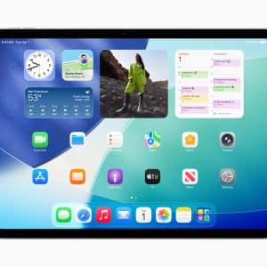 A tablet running iPadOS 26 displays a home screen with app icons and widgets—clock, weather, calendar, and photo—set against a blue and teal gradient background.