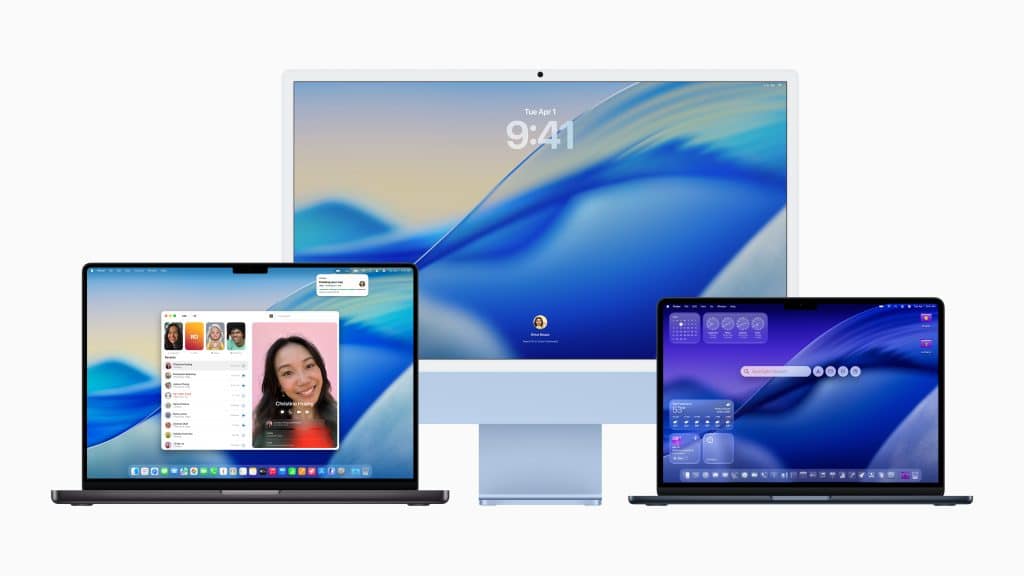 Three Apple devices with blue-themed screens: an iMac in the center displaying the macOS Tahoe login screen, and two MacBook laptops on either side showing video calls and widgets, all on a white background.