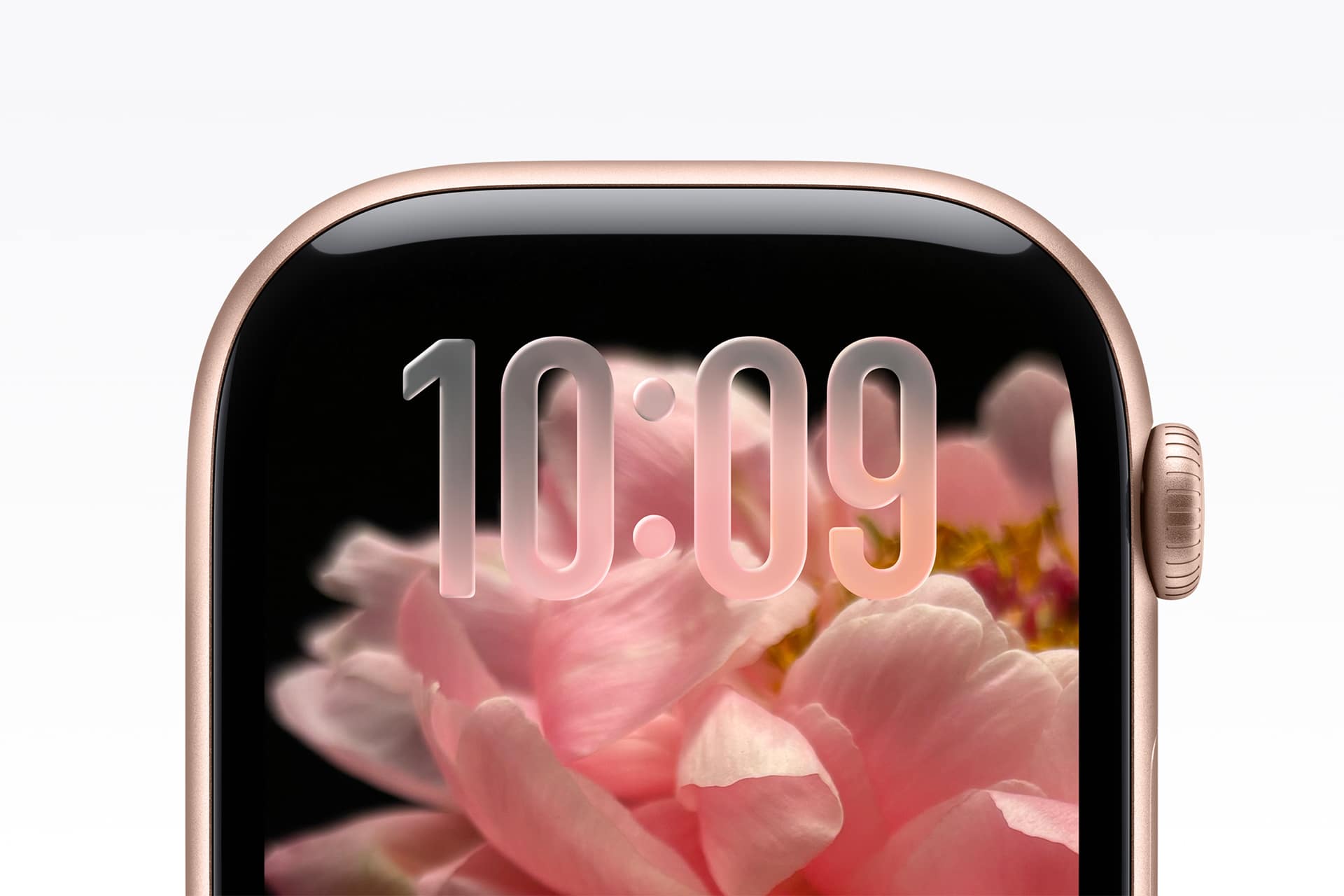 A close-up of a smartwatch screen displaying the time 10:09 with a pink flower in the background. The watch has a gold-colored edge and a rounded digital crown on the right side.