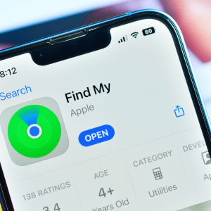 Close-up of a smartphone screen displaying Find My on iPhone in the App Store, highlighting the app icon, "Open" button, ratings, age rating, and category details.
