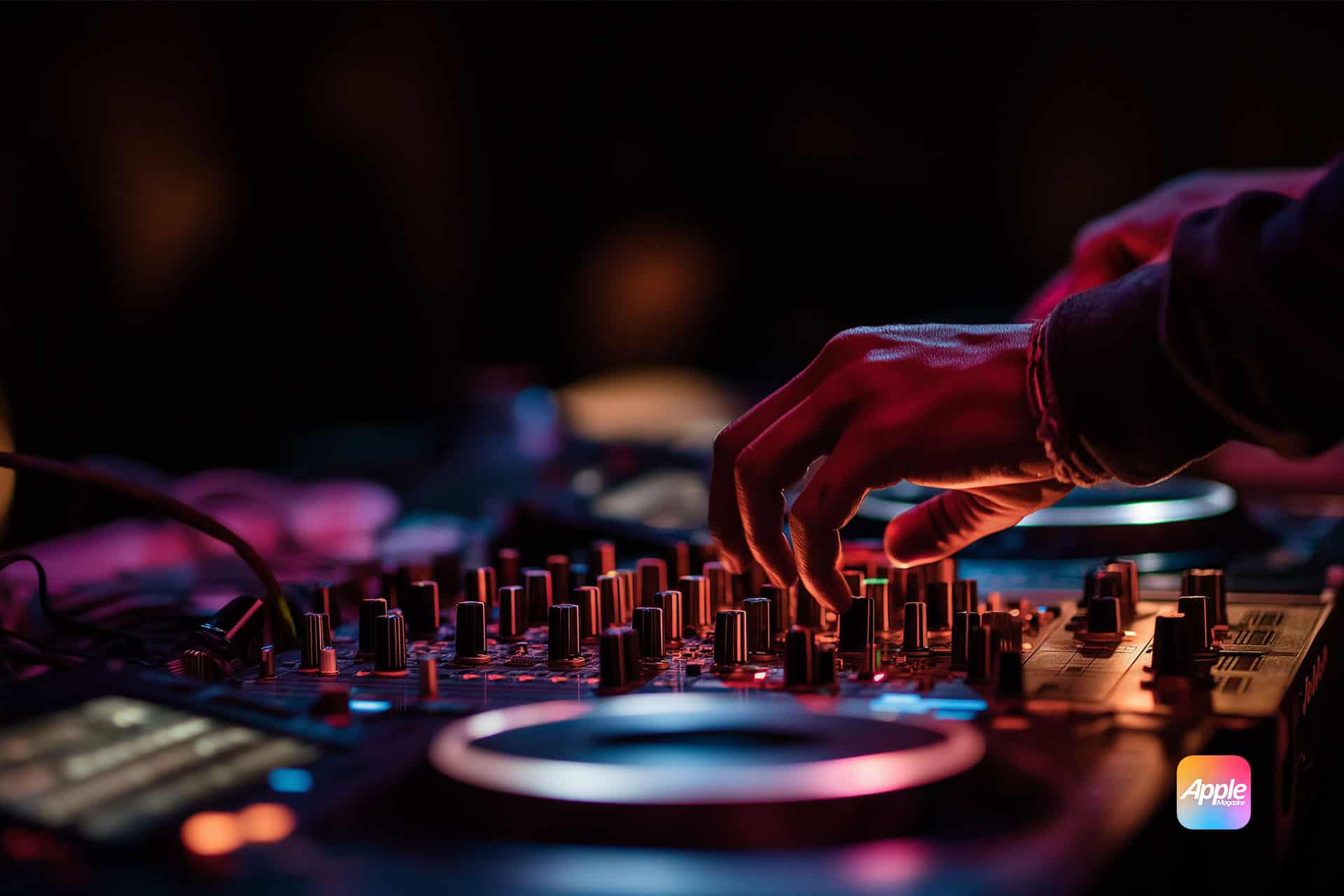A close-up of a DJ’s hands adjusting knobs and sliders on a mixing console, illuminated by colorful lights, with an Apple Music logo in the corner—highlighting key Apple AutoMix features for seamless mixing.