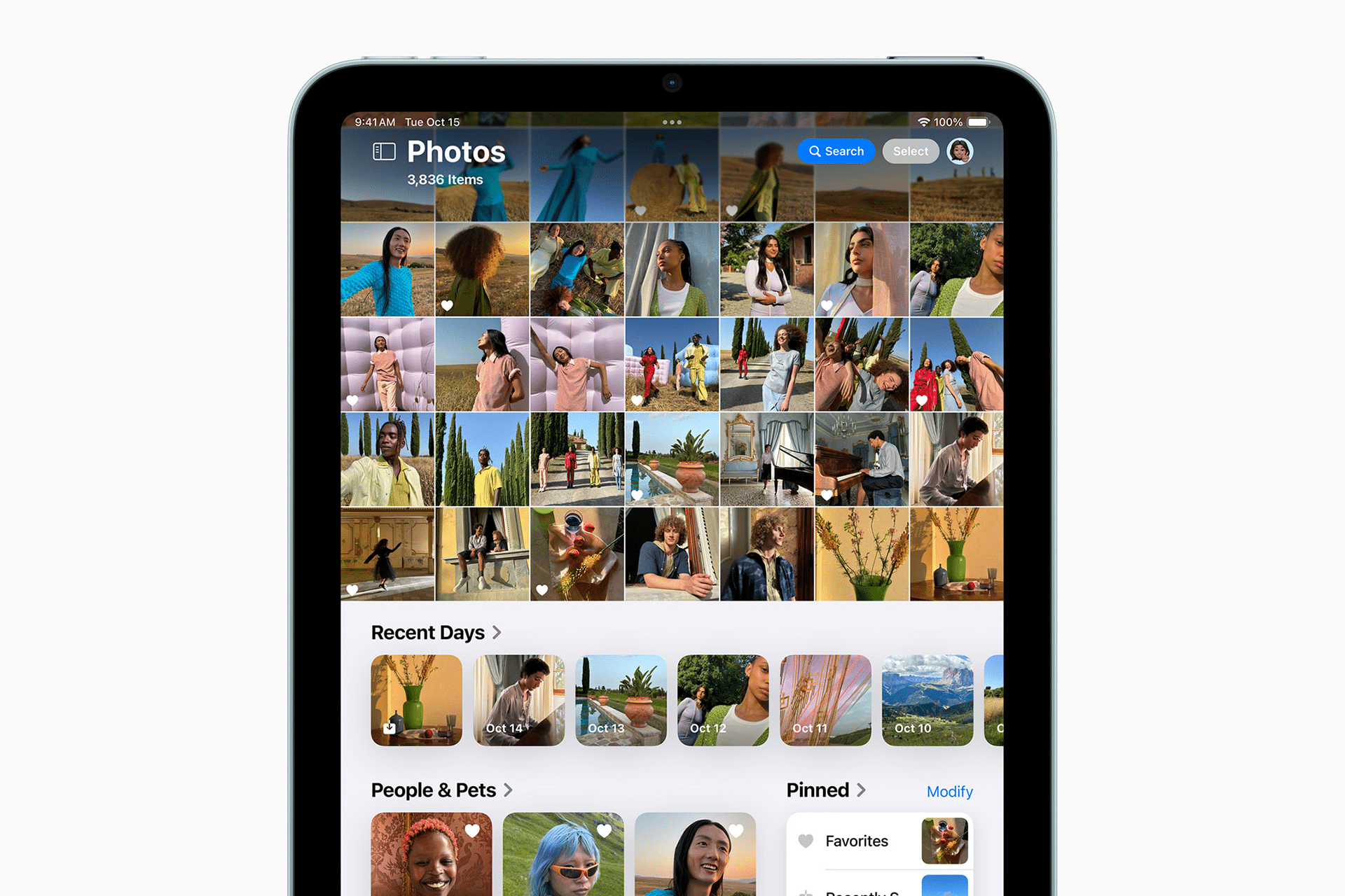 A tablet screen displays the Photos app, featuring a grid of colorful photo thumbnails at the top and sections for Recent Days, People & Pets, and Pinned collections below—perfect for keeping memories organized with Family Sharing.