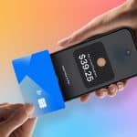 A person taps a blue contactless credit card on the back of a smartphone displaying a payment screen with an amount of $39.25. The background is a colorful gradient, and an Apple logo appears in the bottom right corner.