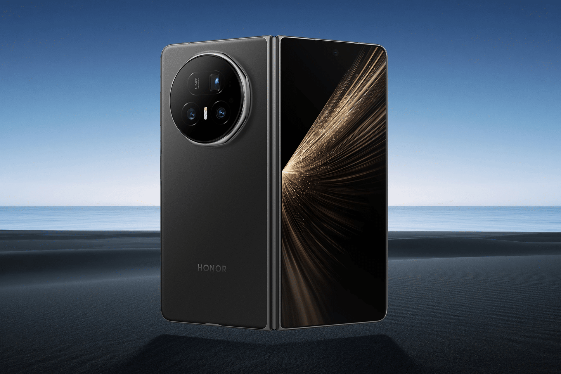 A black Honor Magic V5 Foldable phone is displayed on a sandy beach background, shown both open with a bright screen and closed to reveal its rear camera module.