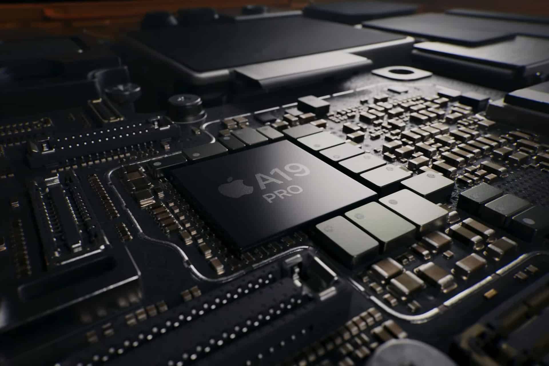 Apple ARM architecture - Close-up of a computer motherboard featuring a central chip labeled "Apple A19 PRO," surrounded by various electronic components and circuitry.