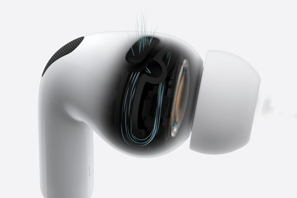 A close-up of a white wireless earbud, resembling Apple’s noise-canceling earbuds, with a partially transparent casing that reveals its internal components and airflow lines, highlighting the ear tip and mesh areas.