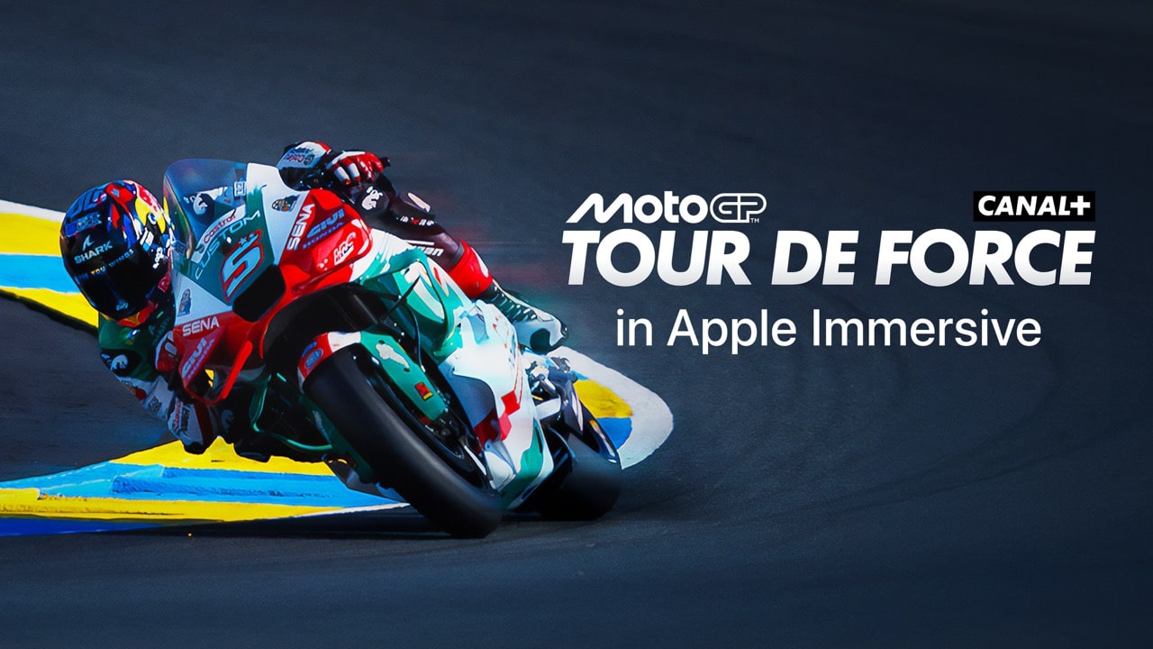 A MotoGP rider leans into a turn on a racetrack. Text reads "MotoGP Tour de Force Canal+ in Apple Immersive"—experience spatial storytelling Vision Pro brings to life.