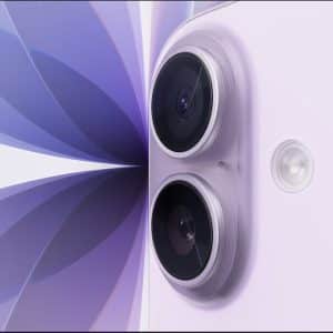 Close-up of a lavender-colored smartphone, resembling the iPhone 17, showing two rear cameras and a flash, set against an abstract purple and white geometric background.