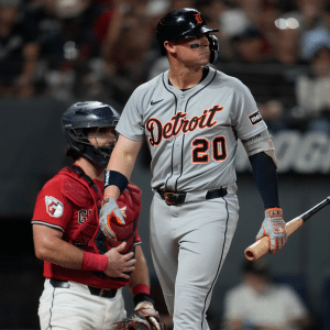 A Detroit Tigers player stands at home plate holding a bat, glancing to the side, as the Red Sox catcher in red gear waits behind him during a Red Sox vs Tigers game—captured perfectly on an iPhone 17 Pro.