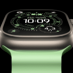 A close-up of the Apple Watch 2025 with a green band displays the time 10:09 and various digital metrics, including location, altitude, and GPS data, highlighting new features and cutting-edge health innovations on its black and green interface.
