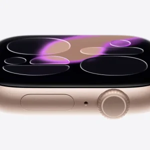 A close-up side view of a gold Apple Watch Series 11 with a light band, displaying a modern, abstract watch face with purple and beige circular patterns—highlighting the device’s advanced features like the Hypertension Monitor.